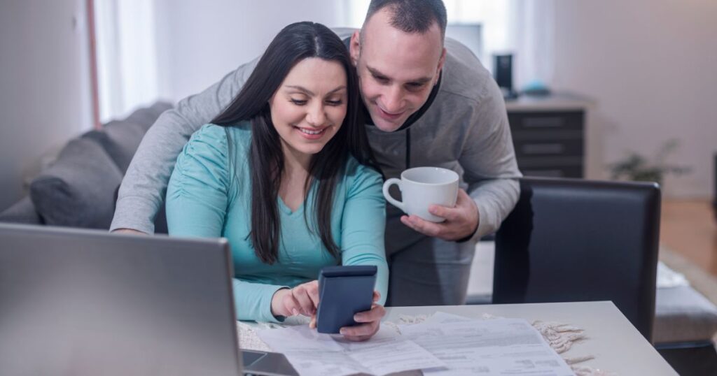 couple working on finances for financial reset